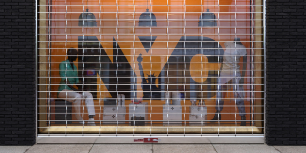commercial grille covering a storefront window for extra security
